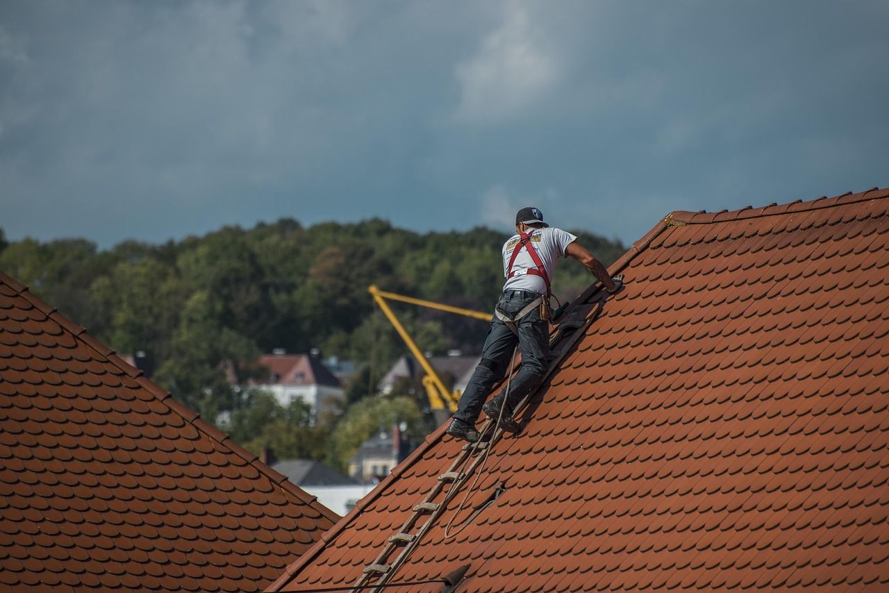 Roofing replacement crew at work in Grant, MI
