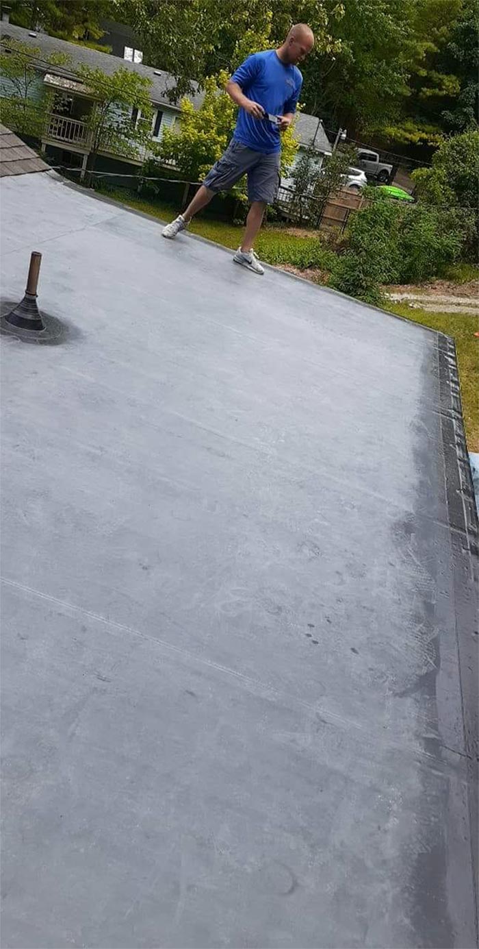 EPDM roofing installation on a flat roof in Grant, MI
