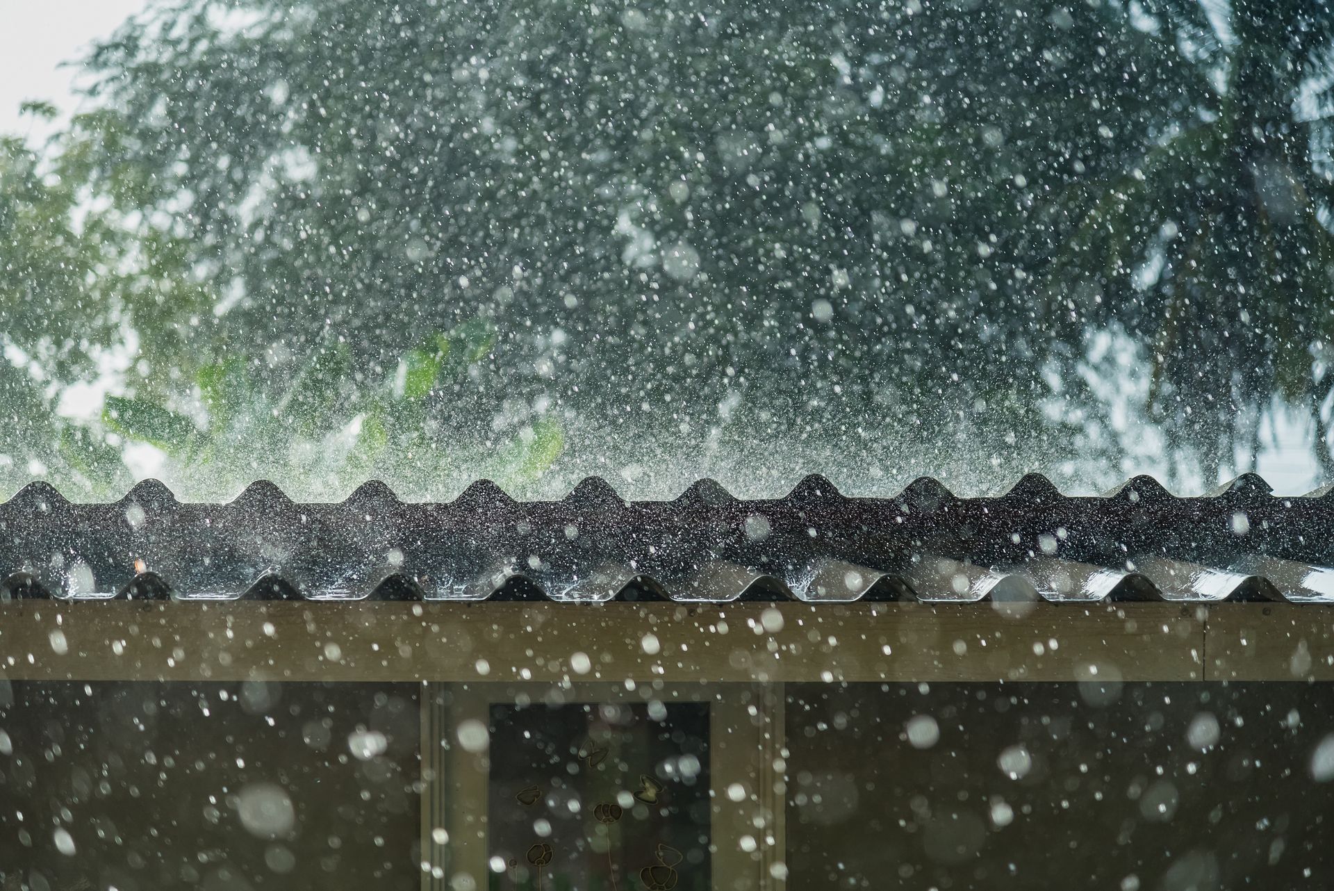 Hail-damaged roof being repaired in Grant, MI